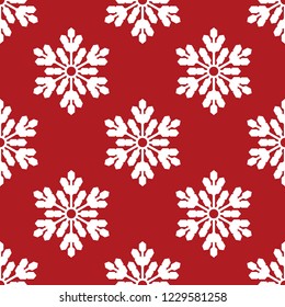 Christmas elements seamless pattern of white snowflakes on red background. Design for winter holiday season background and wrapping papers etc. Vector illustration.