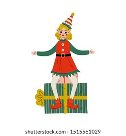 Christmas Elf Character Sitting on Gift Box, Cute Girl Santa Claus Helper Vector Illustration