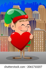 Christmas Elf hugging big red heart. Vector cartoon character illustration of Santa Claus's little worker, helper.