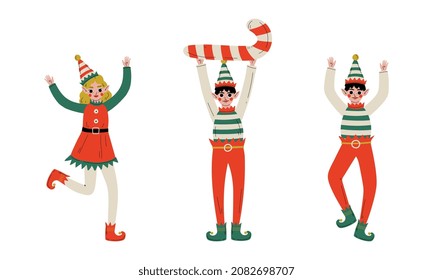 Christmas Elf with Pointy Ears and Hat as Santa Helper Cheering and Holding Candy Cane Vector Set
