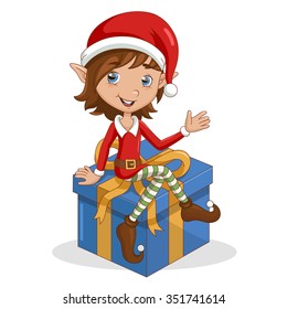 Christmas elf sitting on gift.