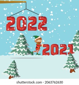 christmas elf worked in snowy landscape, little man changing number 2021 and crane setting 2022