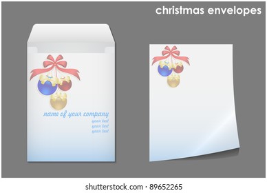 Christmas envelope with sheet of paper and festive balls