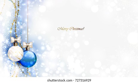 Christmas evening balls with white bows and golden garlands. Merry Christmas gold lettering on the blue shine glimmered background.