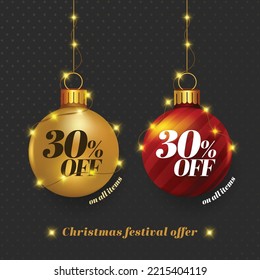 Christmas festival offer units. Offer written on hanging decorative gold and red baubles