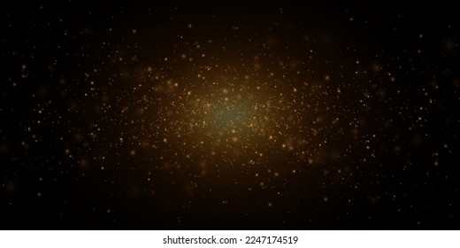 
Christmas festive background of light confetti and small shining golden lights on a black background. Shiny golden texture.