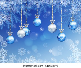 Christmas festive blue background with fir tree branches, snowflakes, ornaments