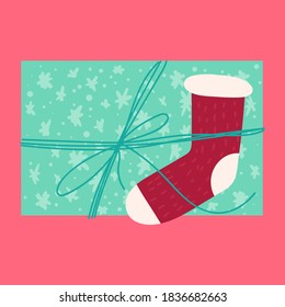 Christmas festive present from above flat vector illustration. Wrapped gift box with knitted sock