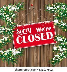 Christmas fir twigs with We are closed sign and snow on the wooden background. Eps 10 vector file.