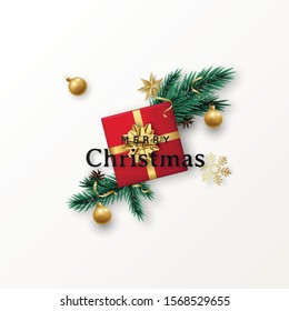 Christmas flat composition with red gift box, Christmas tree branches and decorative baubles. Realistic design for Christmas and New Year isolated on white background.