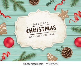 Christmas flat lay design with cookies, ribbons, Christmas ornaments, pine cones, fir branches and greeting card on wooden background