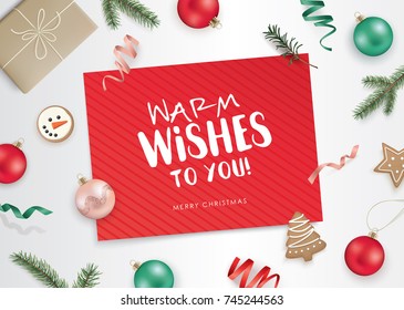 Christmas flat lay design with gift box, ribbons, Christmas ornaments, cookies, fir branches and a red greeting card