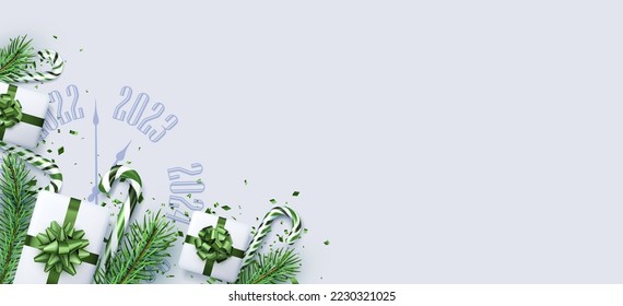 Christmas flatlay composition with clock 2023, gift box, confetti, candy cane, fir branch. Poster, card, banner template with space for text.