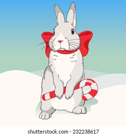 Christmas fluffy white standing rabbit with red ribbon and striped candy