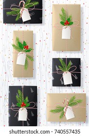 Christmas Flyer with Gift Boxes on Wooden Texture. Top View on Xmas Decoration with Paper Boxes and Confetti for Happy New Year. Vector Illustration.