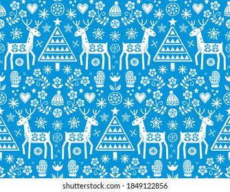 Christmas folk art vector seamless pattern with reindeer, flowers, Xmas tree and winter clothes design in white on blue background - Merry Christmas ornament
