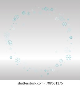Christmas frame or border with random scatter falling blue snowflakes on a silvery background.