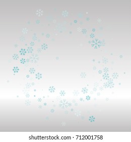 Christmas frame or border with random scatter falling blue snowflakes on a silvery background.