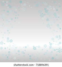 Christmas frame or border with random scatter falling blue snowflakes on a silvery background.