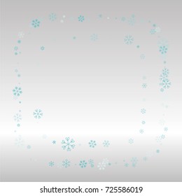 Christmas frame or border with random scatter falling blue snowflakes on a silvery background.