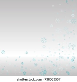 Christmas frame or border with random scatter falling blue snowflakes on a silvery background.