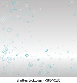 Christmas frame or border with random scatter falling blue snowflakes on a silvery background.