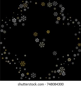 Christmas frame or border with random scatter falling silver and gold snowflakes isolated on black.