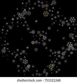 Christmas frame or border with random scatter falling silver and gold snowflakes isolated on black.