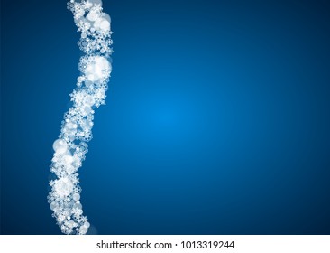 Christmas frame with falling snow on blue background. Horizontal Merry Christmas frame with white frosty snowflakes for banners, gift cards, party invitations and special business offers.