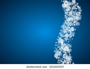 Christmas frame with falling snow on blue background. Horizontal Merry Christmas frame with white frosty snowflakes for banners, gift cards, party invitations and special business offers.