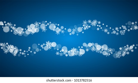 Christmas frame with falling snow on blue background. Horizontal Merry Christmas frame with white frosty snowflakes for banners, gift cards, party invitations and special business offers.