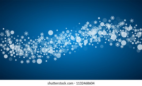 Christmas frame with falling snow on blue background. Horizontal Merry Christmas frame with white frosty snowflakes for banners, gift cards, party invitations and special business offers.