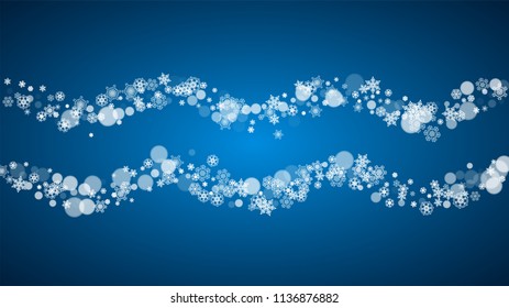 Christmas frame with falling snow on blue background. Horizontal Merry Christmas frame with white frosty snowflakes for banners, gift cards, party invitations and special business offers.