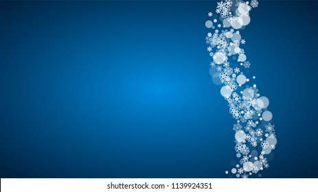 Christmas frame with falling snow on blue background. Horizontal Merry Christmas frame with white frosty snowflakes for banners, gift cards, party invitations and special business offers.