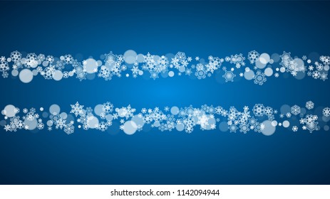 Christmas frame with falling snow on blue background. Horizontal Merry Christmas frame with white frosty snowflakes for banners, gift cards, party invitations and special business offers.