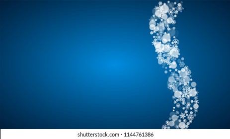 Christmas frame with falling snow on blue background. Horizontal Merry Christmas frame with white frosty snowflakes for banners, gift cards, party invitations and special business offers.