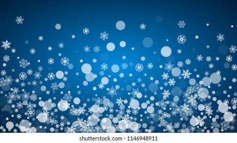 Christmas frame with falling snow on blue background. Horizontal Merry Christmas frame with white frosty snowflakes for banners, gift cards, party invitations and special business offers.