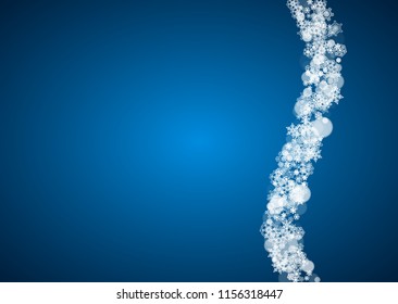 Christmas frame with falling snow on blue background. Horizontal Merry Christmas frame with white frosty snowflakes for banners, gift cards, party invitations and special business offers.