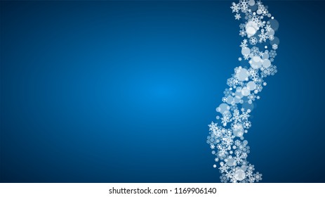 Christmas frame with falling snow on blue background. Horizontal Merry Christmas frame with white frosty snowflakes for banners, gift cards, party invitations and special business offers.