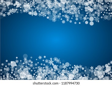 Christmas frame with falling snow on blue background. Horizontal Merry Christmas frame with white frosty snowflakes for banners, gift cards, party invitations and special business offers.