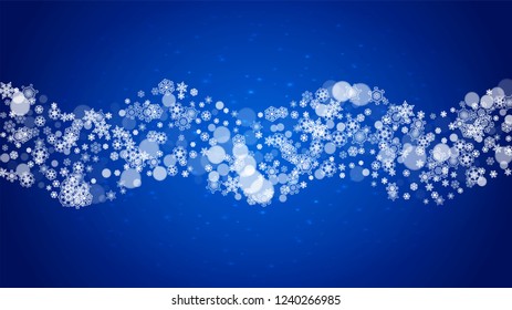 Christmas frame with falling snow on blue background with sparkles. Horizontal Christmas frame with white frosty snowflakes for banners, gift cards, party invitations and special business offers.