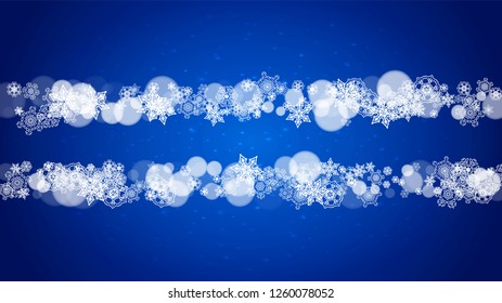 Christmas frame with falling snow on blue background with sparkles. Horizontal Christmas frame with white frosty snowflakes for banners, gift cards, party invitations and special business offers.