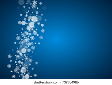 Christmas frame with falling snow on blue background. Horizontal Merry Christmas frame with white frosty snowflakes for banners, gift cards, party invitations and special business offers.