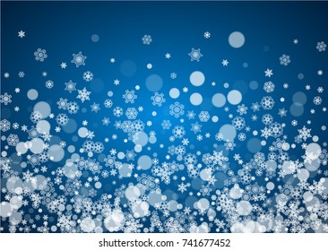 Christmas frame with falling snow on blue background. Horizontal Merry Christmas frame with white frosty snowflakes for banners, gift cards, party invitations and special business offers.