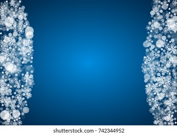 Christmas frame with falling snow on blue background. Horizontal Merry Christmas frame with white frosty snowflakes for banners, gift cards, party invitations and special business offers.