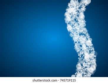 Christmas frame with falling snow on blue background. Horizontal Merry Christmas frame with white frosty snowflakes for banners, gift cards, party invitations and special business offers.