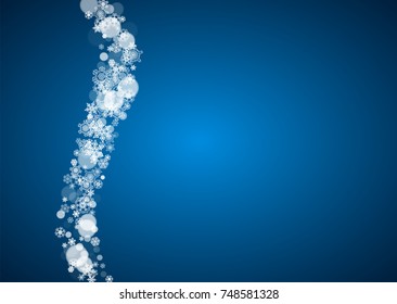 Christmas frame with falling snow on blue background. Horizontal Merry Christmas frame with white frosty snowflakes for banners, gift cards, party invitations and special business offers.