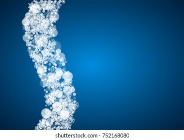 Christmas frame with falling snow on blue background. Horizontal Merry Christmas frame with white frosty snowflakes for banners, gift cards, party invitations and special business offers.