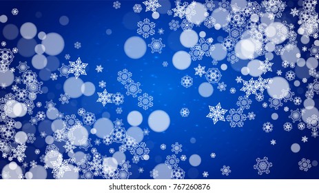 Christmas frame with falling snow on blue background with sparkles. Horizontal Christmas frame with white frosty snowflakes for banners, gift cards, party invitations and special business offers.