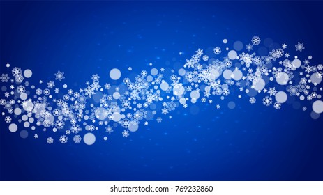 Christmas frame with falling snow on blue background with sparkles. Horizontal Christmas frame with white frosty snowflakes for banners, gift cards, party invitations and special business offers.